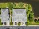 Aerial view of two townhouses near a lake at 521 Harbor Ridge Dr, Palm Harbor, FL 34683