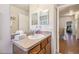 Bathroom with single sink vanity and view of hallway at 521 Harbor Ridge Dr, Palm Harbor, FL 34683