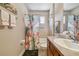 Bathroom with tub, shower, and flamingo-themed decor at 521 Harbor Ridge Dr, Palm Harbor, FL 34683