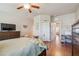 Main bedroom with wood floors and access to the bathroom at 521 Harbor Ridge Dr, Palm Harbor, FL 34683