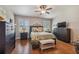 Spacious bedroom with wood floors, large windows, and ample closet space at 521 Harbor Ridge Dr, Palm Harbor, FL 34683