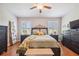 Bright bedroom with wood floors, large windows, and ample closet space at 521 Harbor Ridge Dr, Palm Harbor, FL 34683