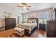 Bedroom with wood floors, large windows, and ample closet space at 521 Harbor Ridge Dr, Palm Harbor, FL 34683