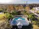 Community pool with lounge chairs and a pool house at 521 Harbor Ridge Dr, Palm Harbor, FL 34683