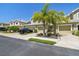 Street view of multiple townhomes in a residential community at 521 Harbor Ridge Dr, Palm Harbor, FL 34683