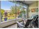 Screened porch overlooking a pond and community at 521 Harbor Ridge Dr, Palm Harbor, FL 34683