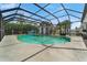 Relaxing kidney-shaped pool with a screened enclosure at 601 42Nd Ne Ave, St Petersburg, FL 33703