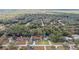 Aerial view of a neighborhood with houses and trees at 6103 Fairway Dr, Ridge Manor, FL 33523