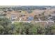 Aerial view of a neighborhood with houses and trees at 6103 Fairway Dr, Ridge Manor, FL 33523