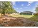 Fenced backyard offering ample space for outdoor activities at 6103 Fairway Dr, Ridge Manor, FL 33523