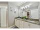 Elegant bathroom with double vanity, granite countertop, and walk-in shower at 6103 Fairway Dr, Ridge Manor, FL 33523