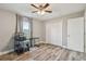 Bright bedroom with window, closet, and home office setup at 6103 Fairway Dr, Ridge Manor, FL 33523