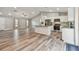 Modern kitchen with white cabinets, granite island, and stainless steel appliances at 6103 Fairway Dr, Ridge Manor, FL 33523
