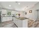Modern kitchen with white cabinets and granite countertops at 6103 Fairway Dr, Ridge Manor, FL 33523