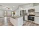 Modern kitchen with granite island and stainless steel appliances at 6103 Fairway Dr, Ridge Manor, FL 33523