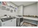 Laundry room with washer, dryer, and extra storage at 6103 Fairway Dr, Ridge Manor, FL 33523