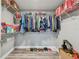 Large walk-in closet with shelving and hanging rods at 6103 Fairway Dr, Ridge Manor, FL 33523