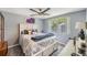 Bright bedroom with a queen-size bed and large window at 6214 Westport Dr, Port Richey, FL 34668