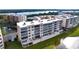 Waterfront condo building showcasing balconies and lush landscaping at 6450 Shoreline Dr # 9203, St Petersburg, FL 33708