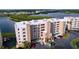 Aerial view of waterfront condo building with parking and landscaping at 6450 Shoreline Dr # 9203, St Petersburg, FL 33708