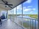 Spacious screened balcony overlooking a tranquil waterway, complete with seating at 6450 Shoreline Dr # 9203, St Petersburg, FL 33708