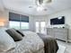 Bright bedroom with city views, a king bed, and large dresser at 6450 Shoreline Dr # 9203, St Petersburg, FL 33708