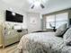 Relaxing bedroom with a queen bed, dresser, and wall-mounted TV at 6450 Shoreline Dr # 9203, St Petersburg, FL 33708