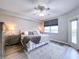 King-size bed, large windows, and a neutral color palette at 6450 Shoreline Dr # 9203, St Petersburg, FL 33708