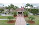 Community building with landscaping and flagpole at 6450 Shoreline Dr # 9203, St Petersburg, FL 33708