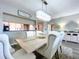 Elegant dining room features a stylish table and chairs, with a pass-through to the kitchen at 6450 Shoreline Dr # 9203, St Petersburg, FL 33708