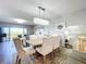 Spacious dining area with a light and airy feel, featuring a large window and access to the living room at 6450 Shoreline Dr # 9203, St Petersburg, FL 33708