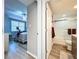 Hallway view of bedroom and bathroom with wood-look flooring at 6450 Shoreline Dr # 9203, St Petersburg, FL 33708