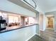 Kitchen with breakfast bar and view to living room at 6450 Shoreline Dr # 9203, St Petersburg, FL 33708