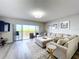 Relaxing living room with a sectional sofa and access to a balcony overlooking a scenic view at 6450 Shoreline Dr # 9203, St Petersburg, FL 33708