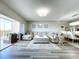 Open living room showcasing a comfortable sectional sofa and access to a balcony with scenic views at 6450 Shoreline Dr # 9203, St Petersburg, FL 33708