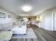 Spacious living room with sectional sofa, offering an open floor plan with views to dining area at 6450 Shoreline Dr # 9203, St Petersburg, FL 33708