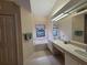 Bathroom features double vanity and a large soaking tub at 9305 Haas Dr, Hudson, FL 34669