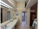 Double vanity bathroom with a shower and separate tub at 9305 Haas Dr, Hudson, FL 34669