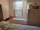 Serene bedroom with window and ample closet space at 9305 Haas Dr, Hudson, FL 34669