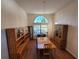 Dining room with wood floors, large windows and a chandelier at 9305 Haas Dr, Hudson, FL 34669