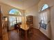 Spacious dining area with large windows and wood floors at 9305 Haas Dr, Hudson, FL 34669