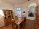 Bright dining room with wood floors and a wood hutch at 9305 Haas Dr, Hudson, FL 34669