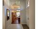 Bright entryway with tiled floors and view of dining area at 9305 Haas Dr, Hudson, FL 34669