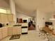 Open kitchen with breakfast nook and view of living room at 9305 Haas Dr, Hudson, FL 34669