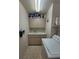 Laundry room features washer, dryer, cabinets, and sink at 9305 Haas Dr, Hudson, FL 34669