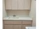 Bright laundry room with cabinets and a utility sink at 9305 Haas Dr, Hudson, FL 34669