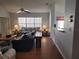 Spacious living room with wood floors and view of kitchen at 9305 Haas Dr, Hudson, FL 34669
