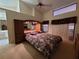 Main bedroom with large bed and built-in mirrored wardrobe at 9305 Haas Dr, Hudson, FL 34669