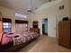 Main bedroom with large bed, dresser and window at 9305 Haas Dr, Hudson, FL 34669
