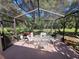 Enjoy the outdoors in this screened patio at 9305 Haas Dr, Hudson, FL 34669
